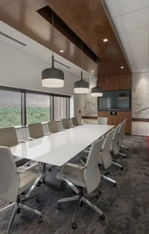 Meeting room with a white gloss conference table, grey mesh chairs, a wood-slat suspended ceiling and drum pendant lights over the table